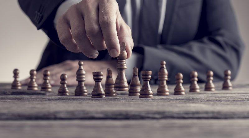 Retro Style Image Of A Businessman Playing A Game Of Chess On An