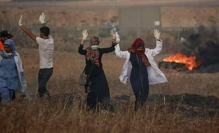 Unconfirmed photo of Razan al-Najjar with hands in the air minutes before being shot