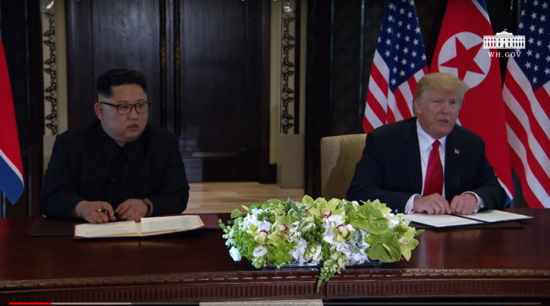 screenshot of President Trump and Chairman Kim at Singapore Summit, June 12, 2018