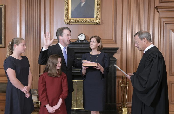 Chief Justice John G. Roberts, Jr., administers the Constitutional Oath to Judge Brett M. Kavanaugh in the Justices’ Conference Room, Supreme Court Building. Mrs. Ashley Kavanaugh holds the Bible. Credit: Fred Schilling, Collection of the Supreme Court of the United States.